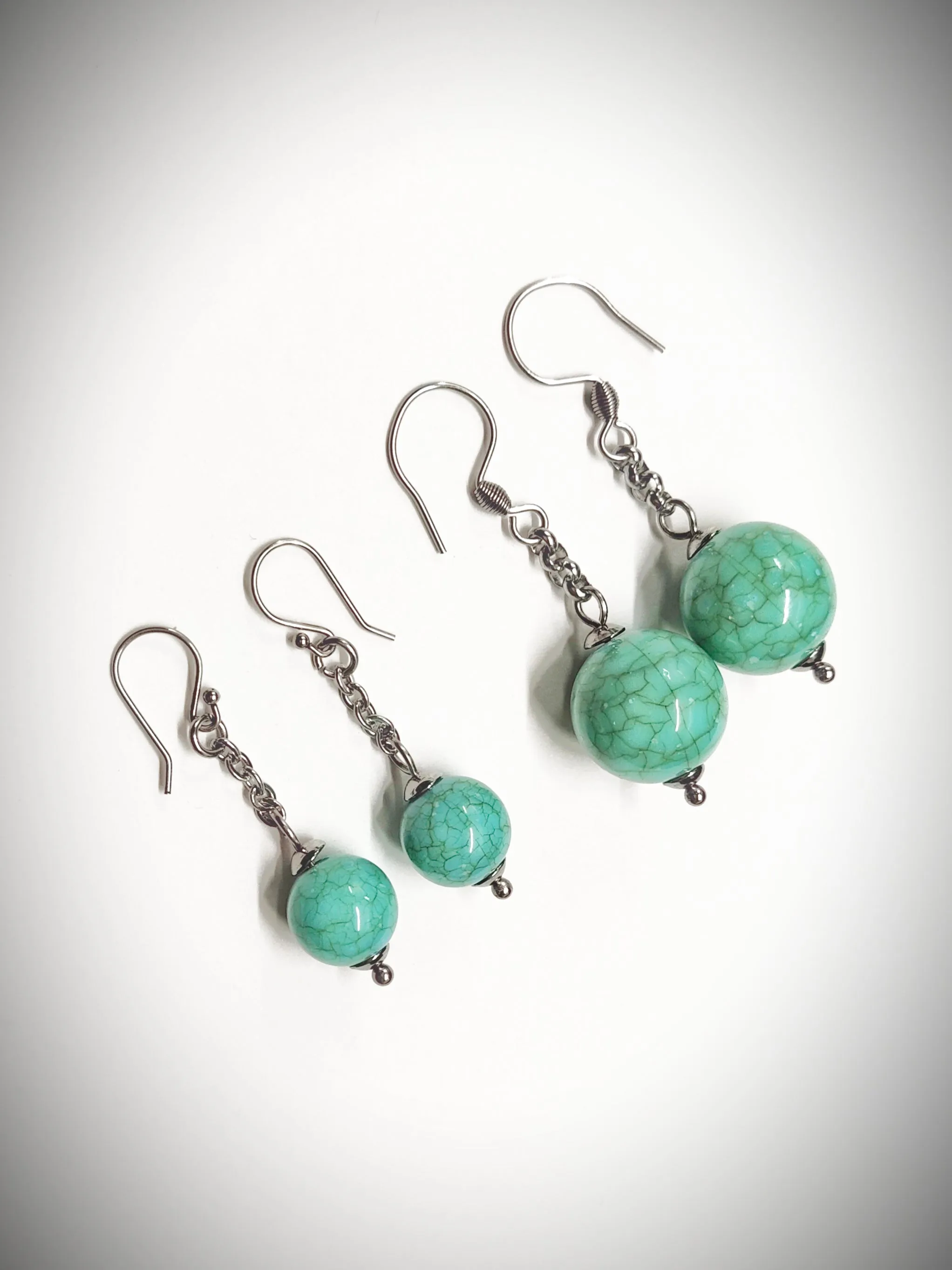 Matching greenish turquoise colour bead earrings for mother and daughter
