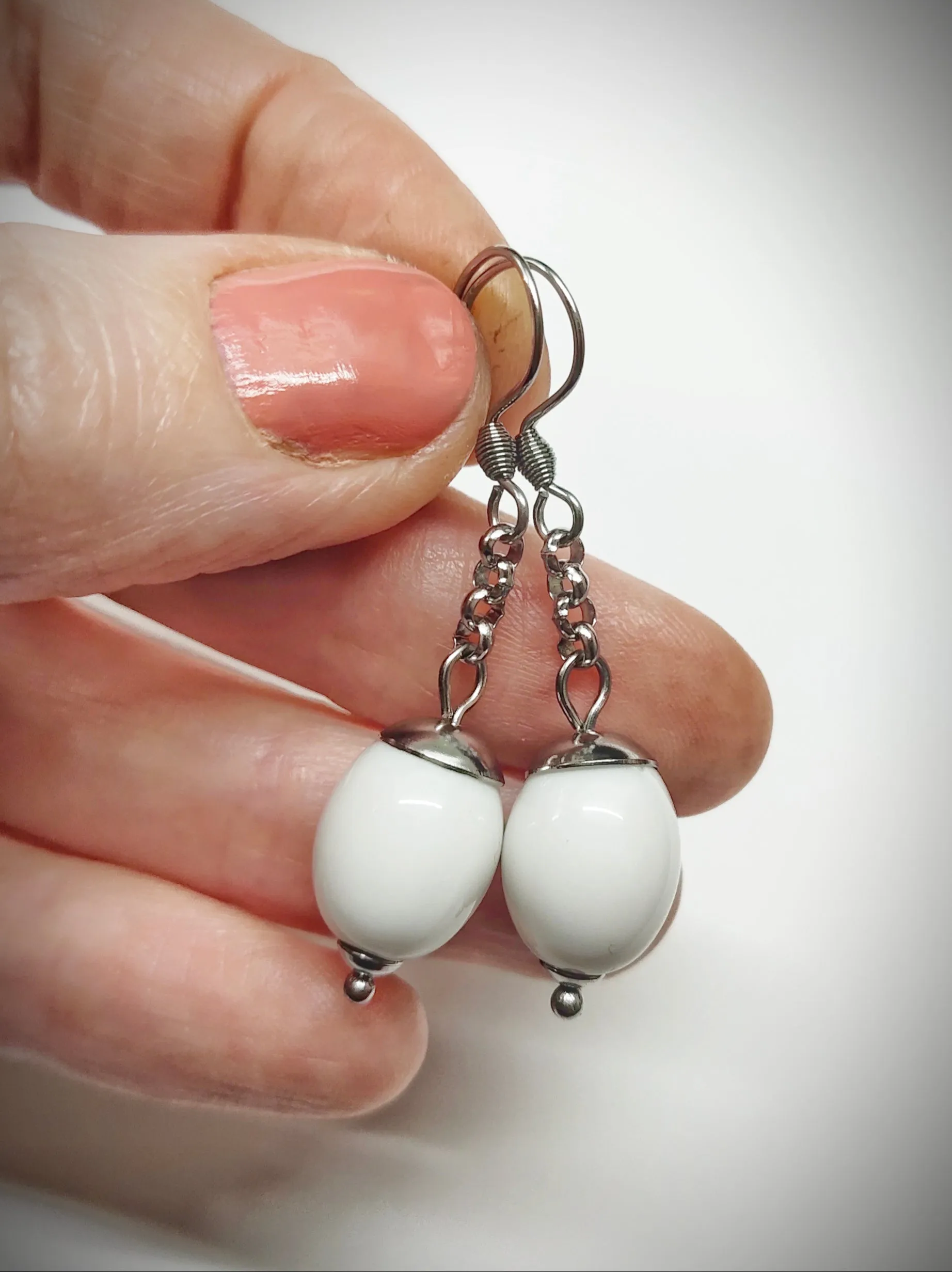 Matching off-white oval beads earrings for mother and daughter