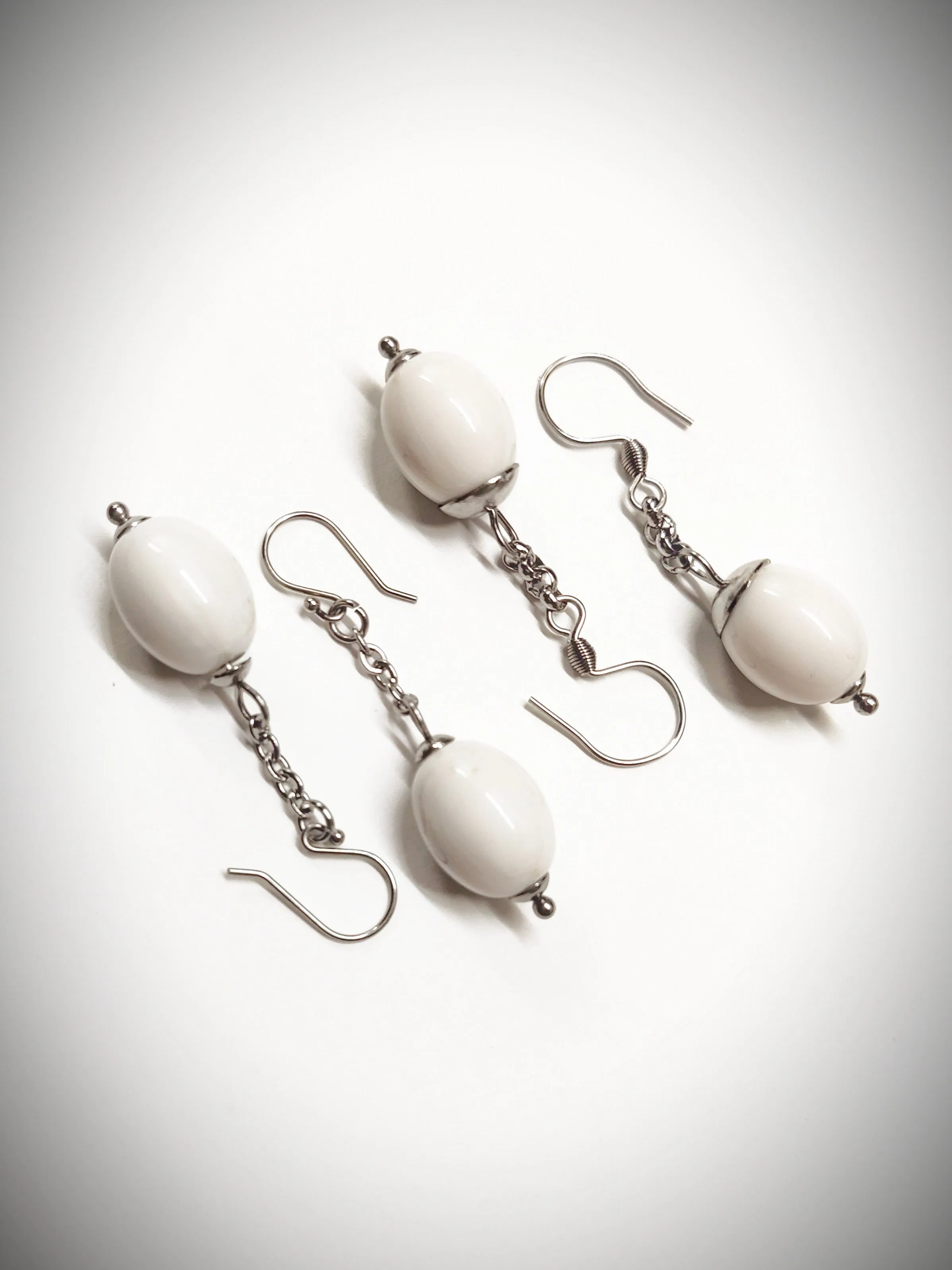 Matching off-white oval beads earrings for mother and daughter