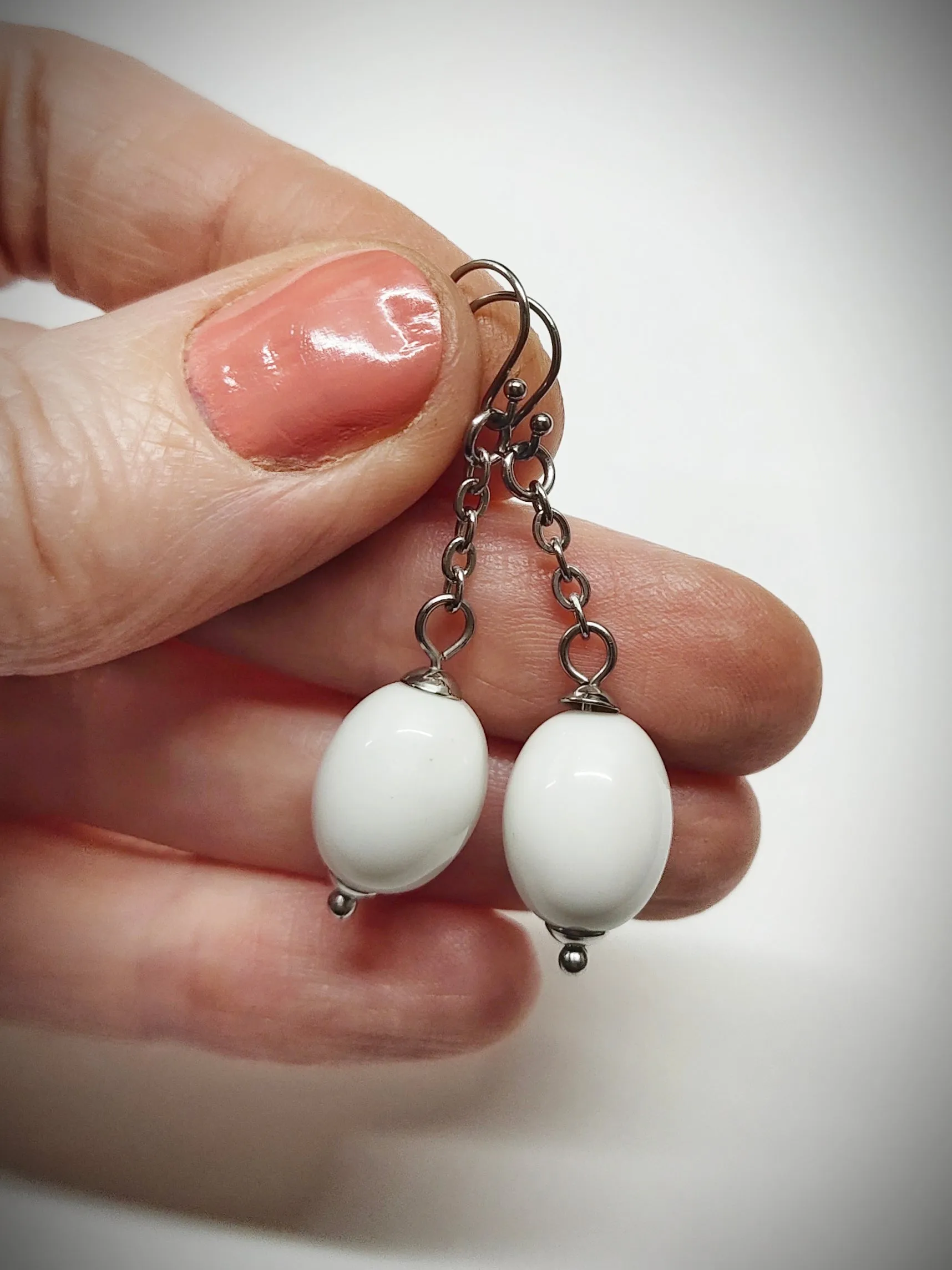 Matching off-white oval beads earrings for mother and daughter