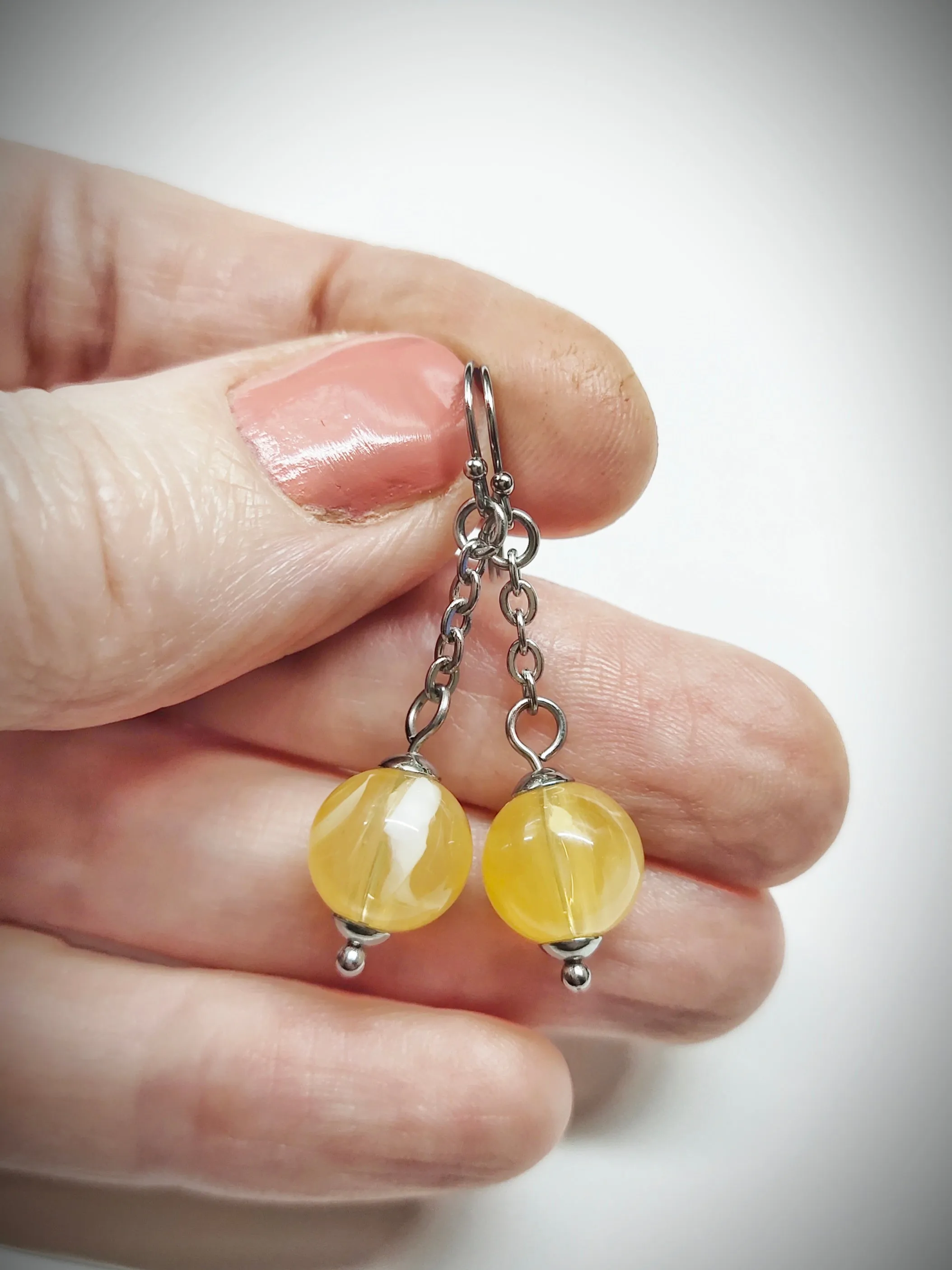 Matching semi clear yellowish bead earrings for mother and daughter