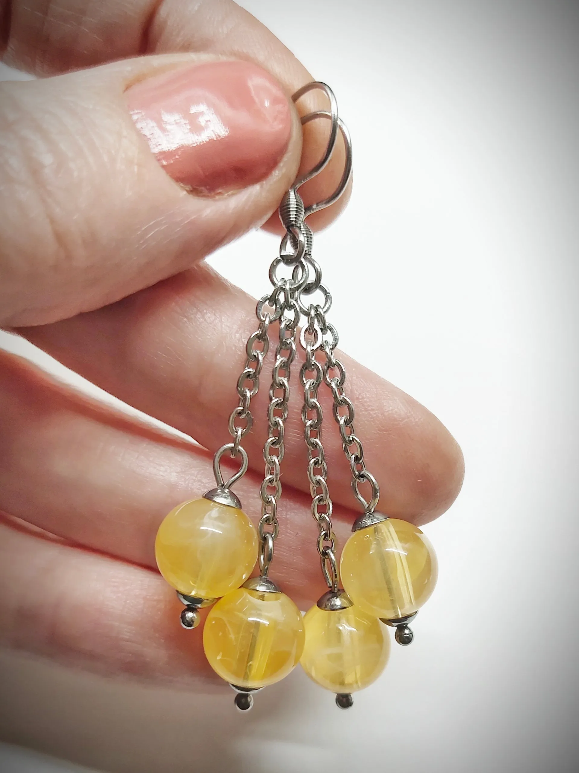 Matching semi clear yellowish bead earrings for mother and daughter