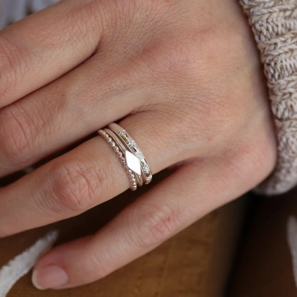 Sterling Silver Slim Band with 7 Star Set CZ Ring